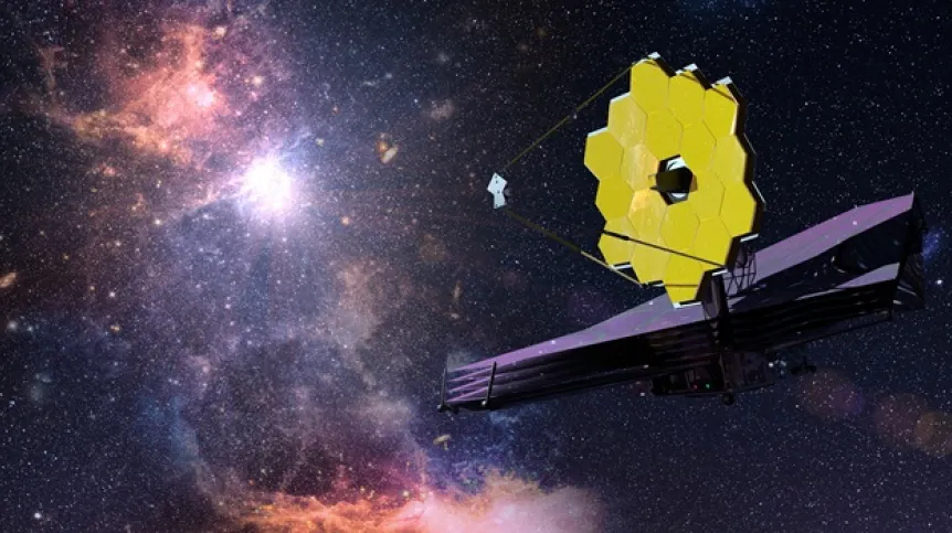 Teleskop Kosmiczny Jamesa Webba ze swoim charakterystycznym złotym, heksagonalnym lustrem, na tle rozległej, rozgwieżdżonej przestrzeni kosmicznej z kolorowymi mgławicami.